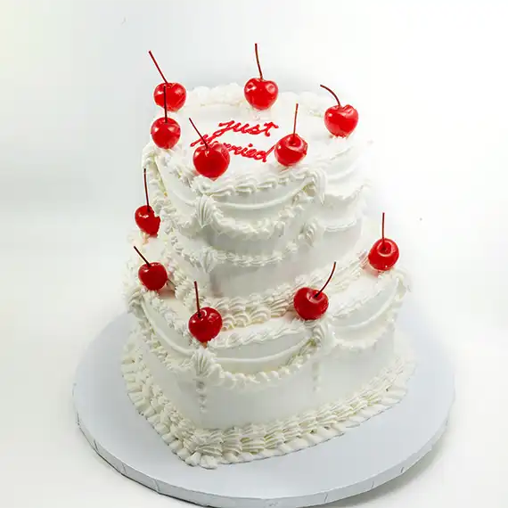 Modern elegance two tier wedding cake with red roses on the top