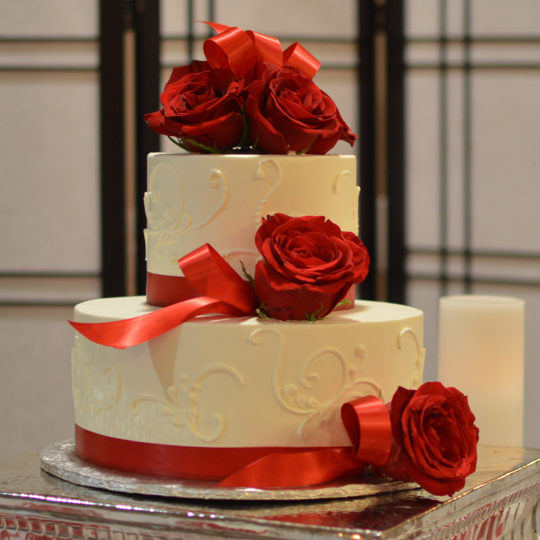 Swirled Elegance Two Tier Wedding Cake with red roses