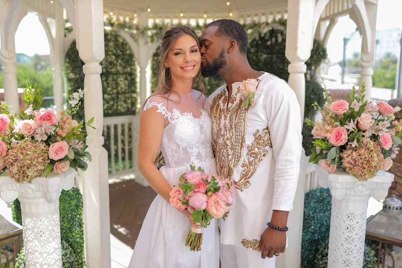A couple getting married at theThe Terrace Gazebo in las Vegas with a beautiful Floral Decor