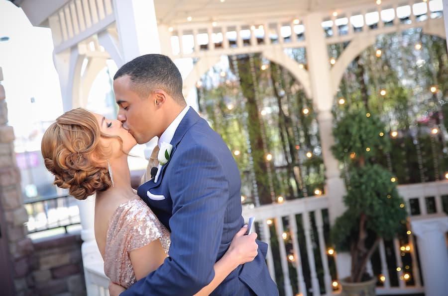 Vegas wedding couple kissing in front of The Gazebo