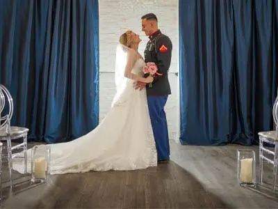 Bride laughing as her man kisses her neck in their professional photos shoot in Las Vegas