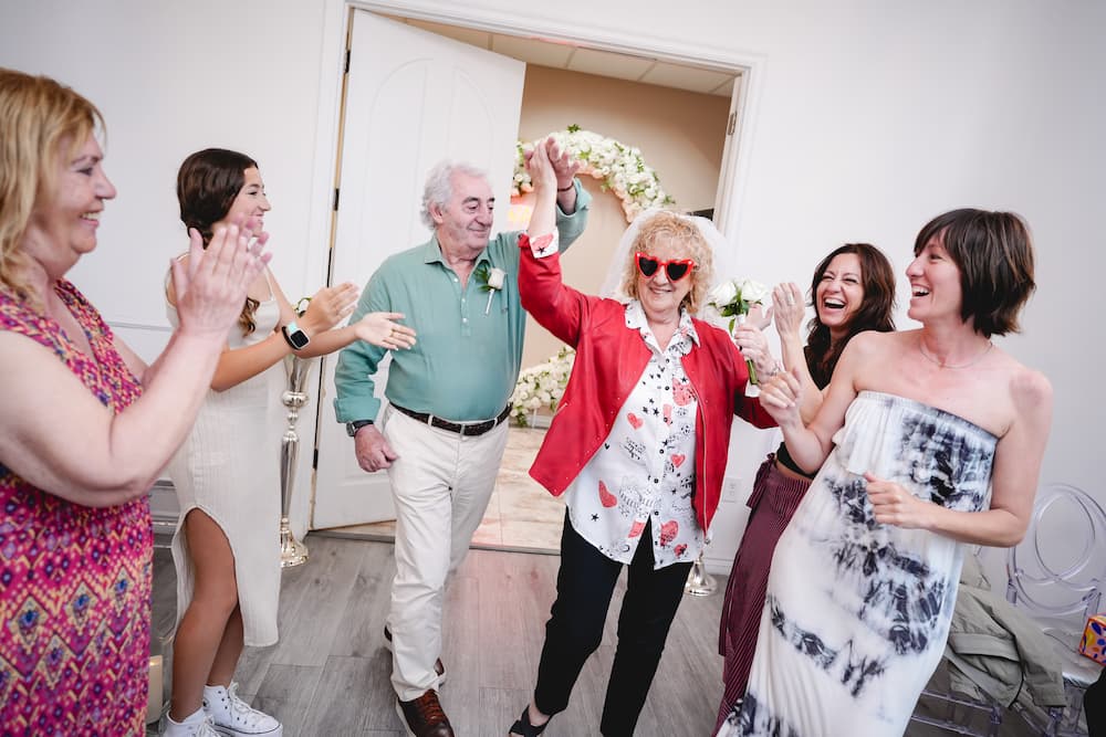 Newlyweds smiling at each other on their ceremony in vegas