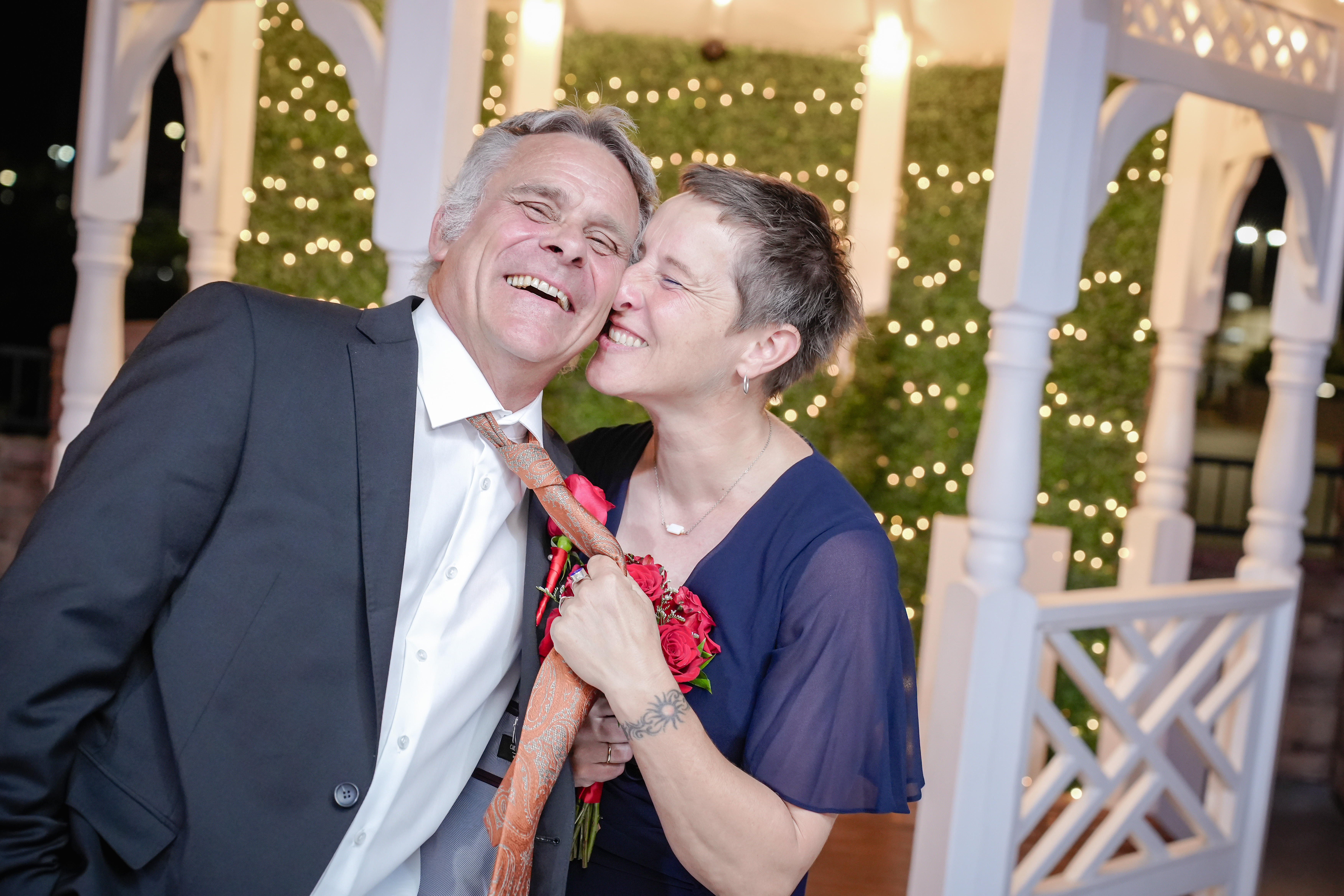 Couple kisses in their gorgeous chapel