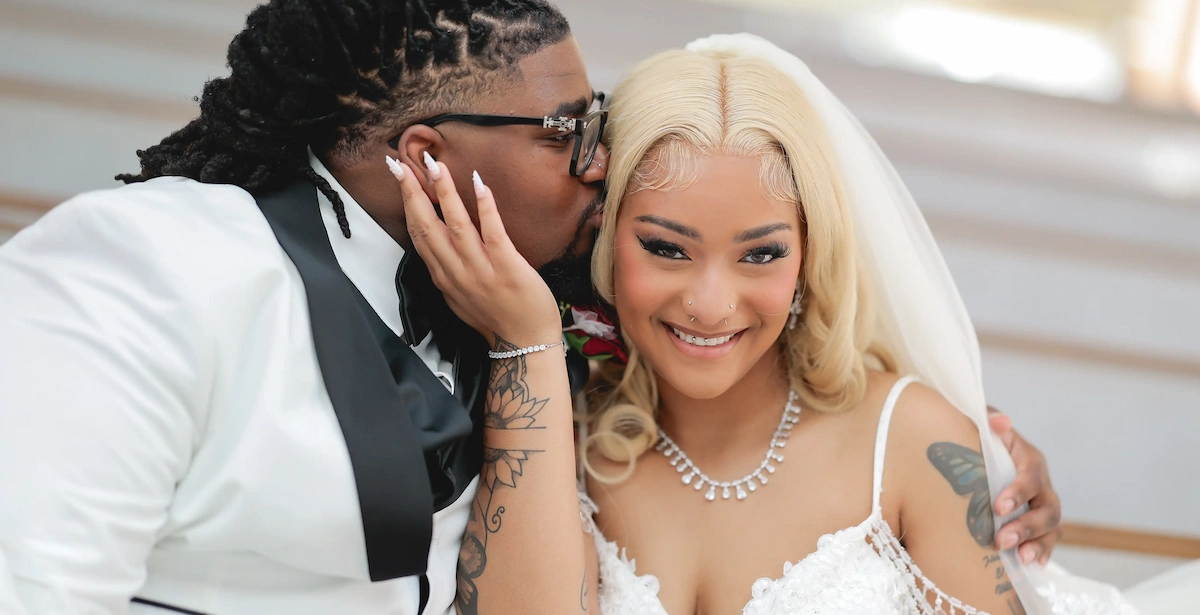 Bride and groom share a tender kiss on the cheek at their Las Vegas wedding, Vegas Weddings